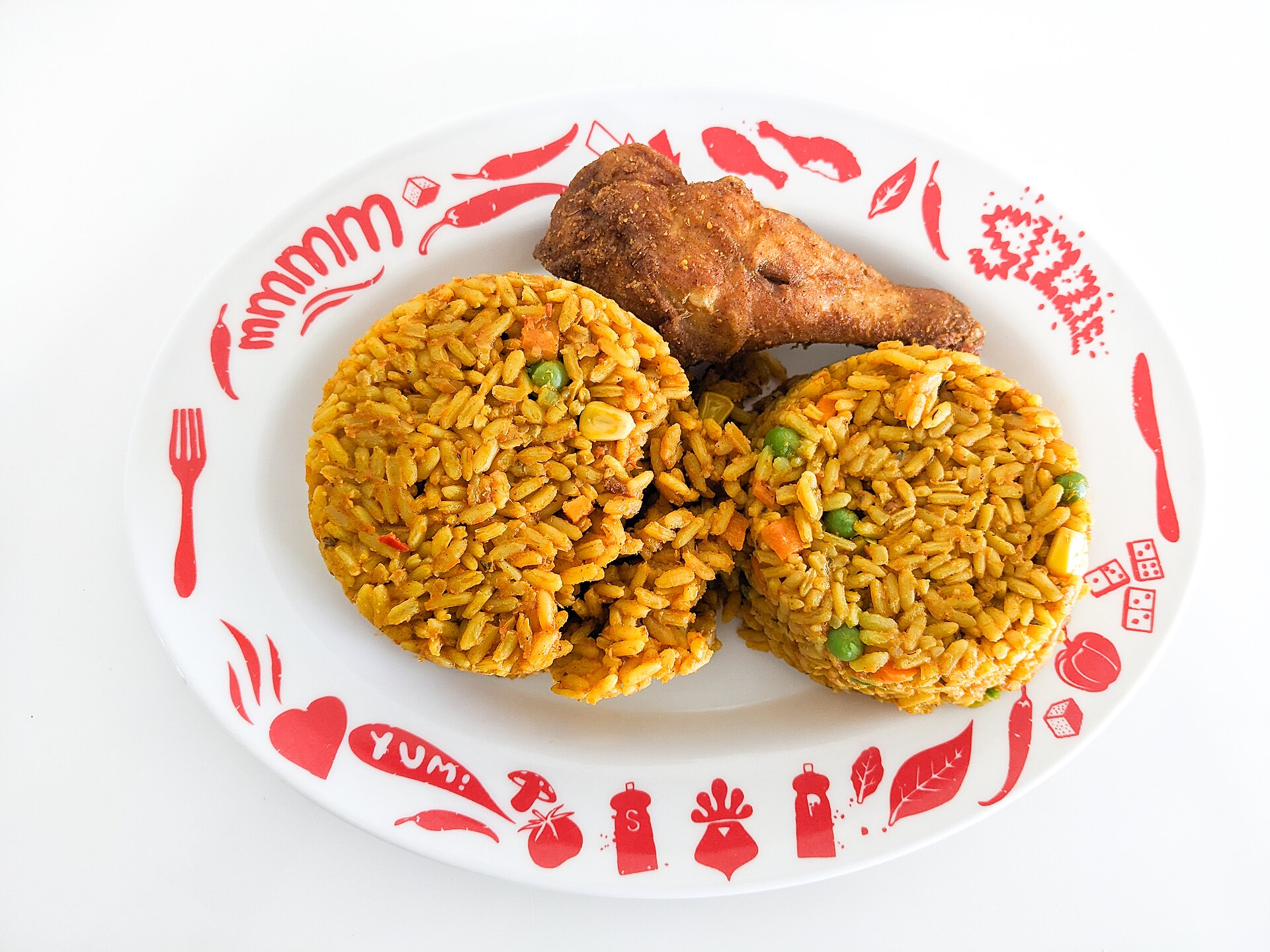 Nigerian jollof rice and chicken served for dine-in